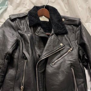 Black leather jacket has small tear in the pocket